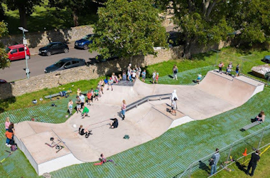 People skating in a new skate park